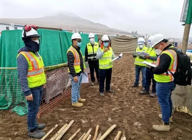 Staff workers check epidemic prevention facilities in a construction site in Peru.